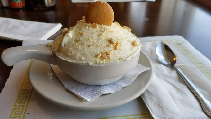 Homemade banana pudding topped with vanilla wafers at Soul Food Factory