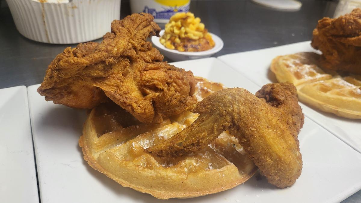 Fried chicken and waffles with a side of mac and cheese at Soul Food Factory