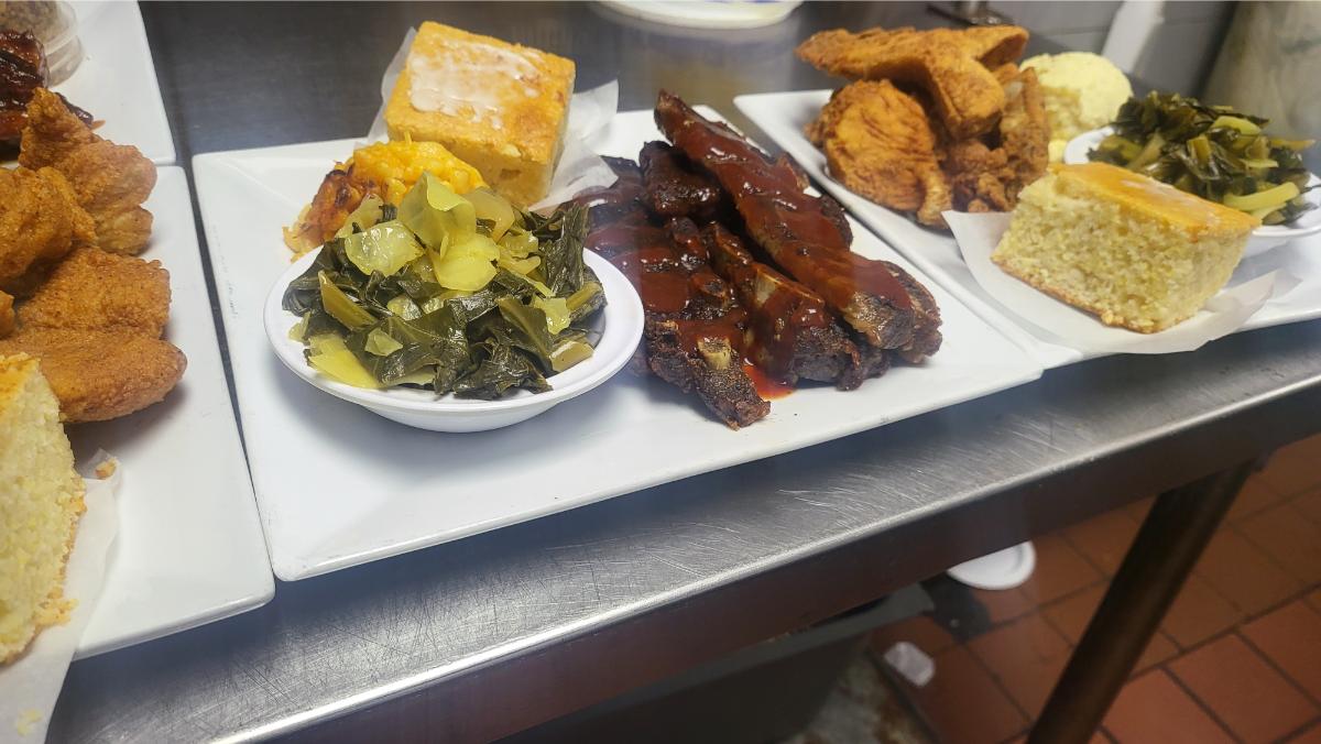 BBQ ribs, fried fish, collard greens, and cornbread platters at Soul Food Factory